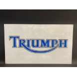 A rectangular Triumph plastic advertising sign, probably the front panel from a lightbox, 39 x 23".