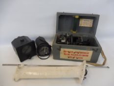 A cased military issue distance indicator, two military dials etc.