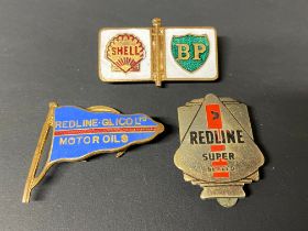 A Redline-Glico enamel lapel badge, a Redline Super badge and a third for Shell-BP.