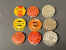 Nine miniature Dunlop chalk and patch tins.