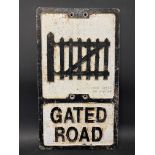 A REPRODUCTION aluminium road sign for Gated Road, by Ham Baker Co. Limited, 12 x 21".