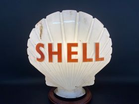 A Shell glass petrol pump globe by Hailware, dated August 1972.