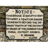 An early cast iron Notice road sign informing that the bridge 'is insufficient to carry a traction