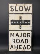 A metal road sign 'Slow Major Road Ahead, with glass reflective discs, 14 x 27 1/2".