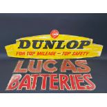 A Dunlop cardboard advertising pediment sign, 39 x 12 1/2", plus a two piece Lucas Batteries hanging