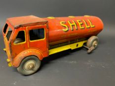 A clockwork tinplate model of a petrol tanker in Shell BP livery.