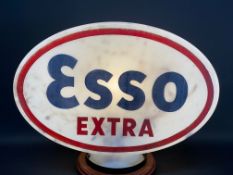 An Esso Extra glass petrol pump globe, stamped British Made and 'Property of Anglo American Oil Co