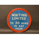 A circular 'Waiting Limited To 30 Mins in any Hour' road sign, 20" diameter.