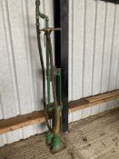 A Wayne skeleton petrol pump for restoration, with rubber hose and bronze nozzle.
