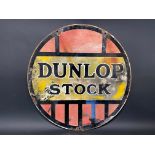 A Dunlop Stock circular double sided enamel sign, 24" diameter.