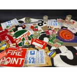 A quantity of garage related stickers and promotional material.