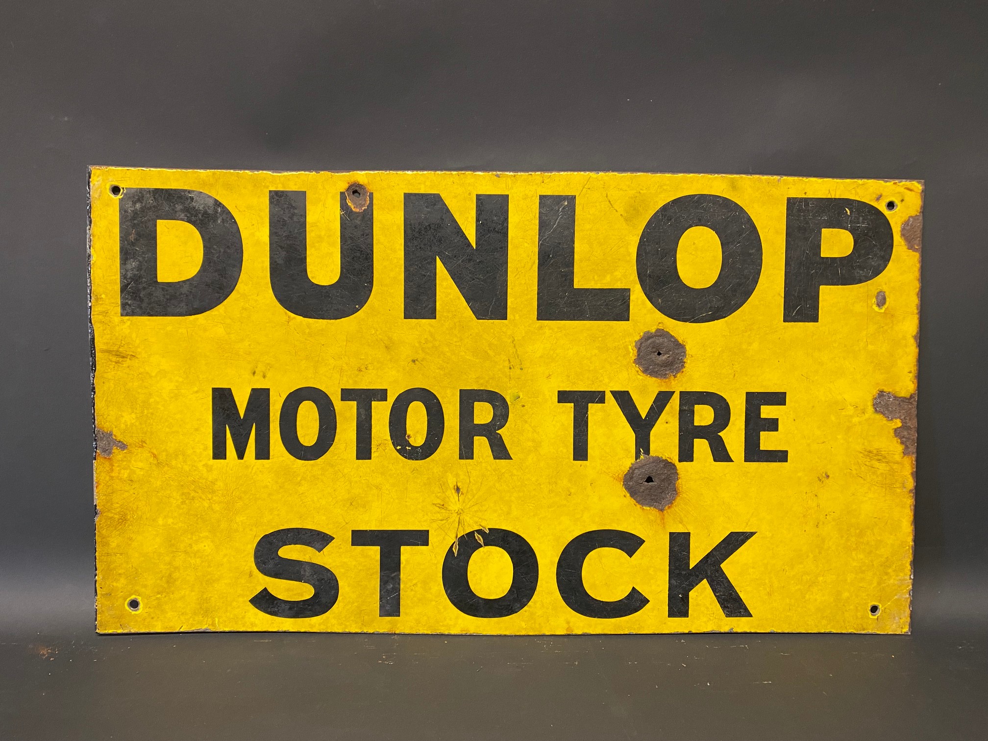 An early Dunlop Motor Tyre Stock rectangular double sided enamel sign, lacking hanging flange and