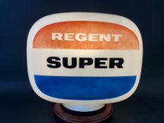 A Regent Super glass petrol pump globe, dated April 1960.