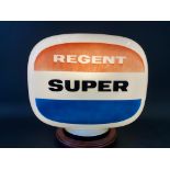 A Regent Super glass petrol pump globe, dated April 1960.