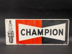 A Champion spark plugs part pictorial tin advertising sign, dated 1969, 23 x 9 1/2".