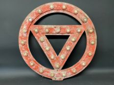 A circular road warning sign with glass reflective discs, 24