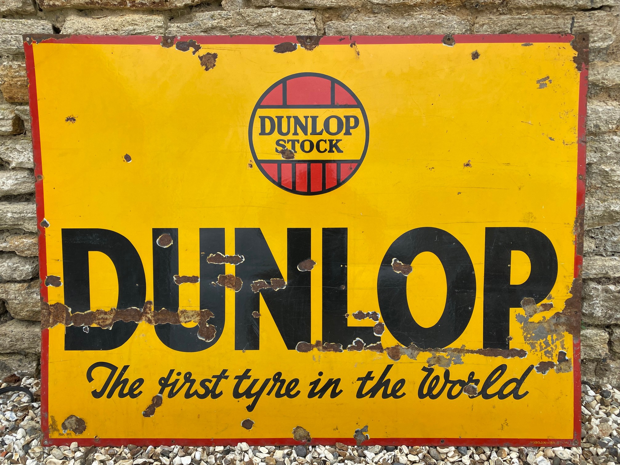 A Dunlop 'The first tyre in the world' rectangular enamel sign by Jordan of Bilston, 48 x 36".