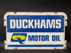 A Duckhams Motor Oil double sided tin garage forecourt rack pediment sign, 23 1/2 x 14 1/4".