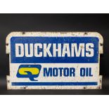 A Duckhams Motor Oil double sided tin garage forecourt rack pediment sign, 23 1/2 x 14 1/4".