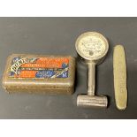 A Dunlop tyre pressure gauge, a pressure gauge tin, for another version and a Dunlop branded