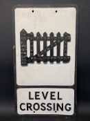 An aluminium road sign for Level Crossing with integral reflective beads, 12 x 21".