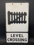 An aluminium road sign for Level Crossing with integral reflective beads, 12 x 21