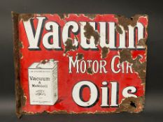 A Vacuum Motor Car Oils part pictorial double sided enamel sign with hanging flange and image of a