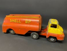 A Tri-ang tinplate model of an articulated petrol tanker in Shell BP livery.