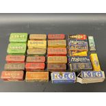 A selection of empty spark plug tins including Sphinx and Lodge, plus various empty cardboard plug