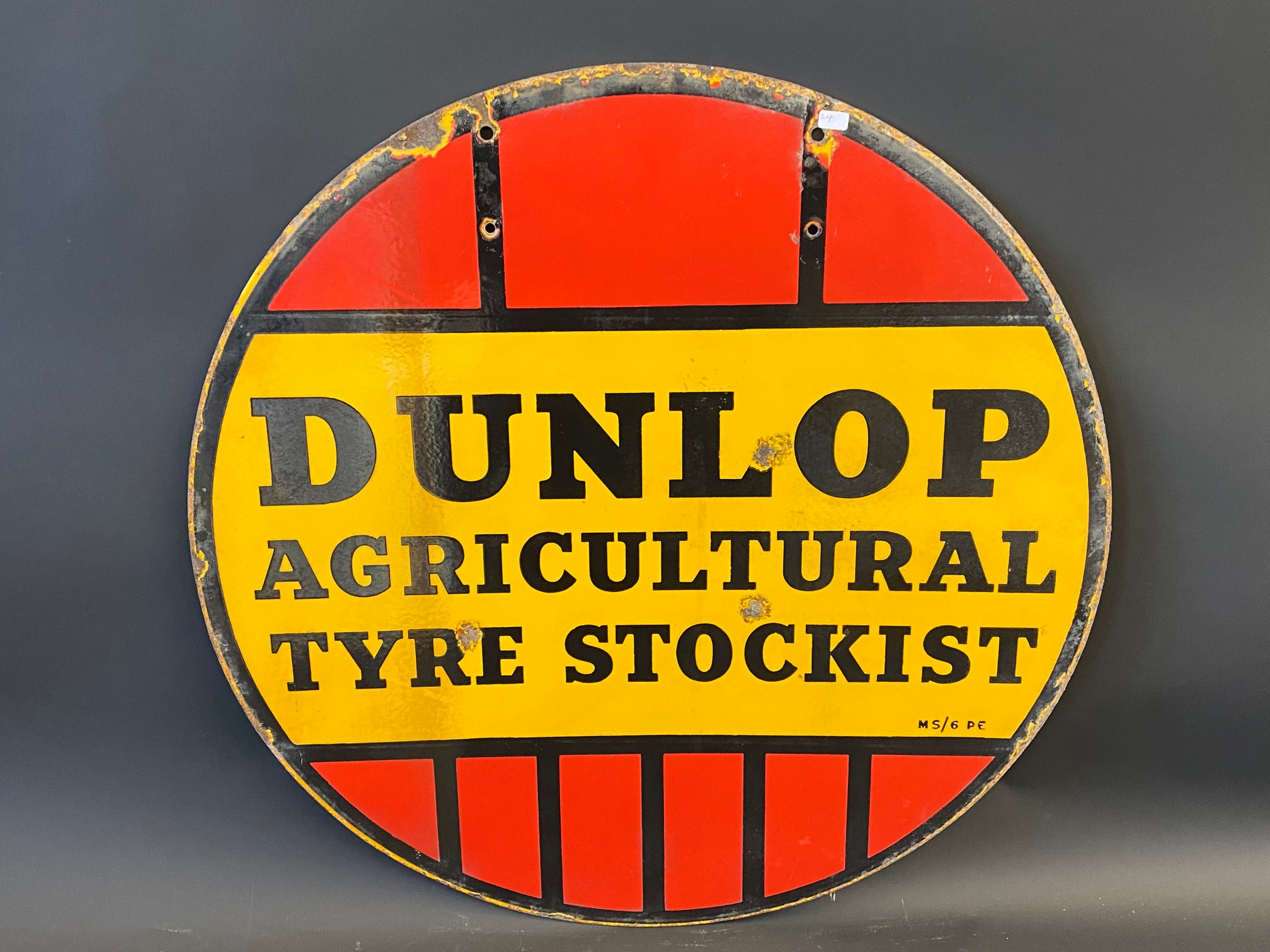 A Dunlop Agricultural Tyre Stockist circular double sided enamel sign, 24" diameter.