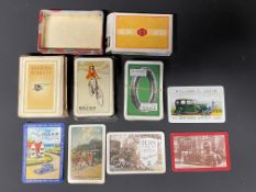 A selection of playing cards all with advertising, including Davies tyres and Raleigh, plus some