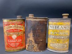 Two Searchlight Cycle and Carriage Lamps oval cans and a third for Midland Lubricating Oil.