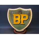 A BP shield shaped glass petrol pump globe, fully stamped 'Property of Shell-Mex & BP Ltd..'.