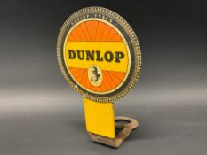 A rarely seen Dunlop advertising badge for fitting to the front of a bicycle.