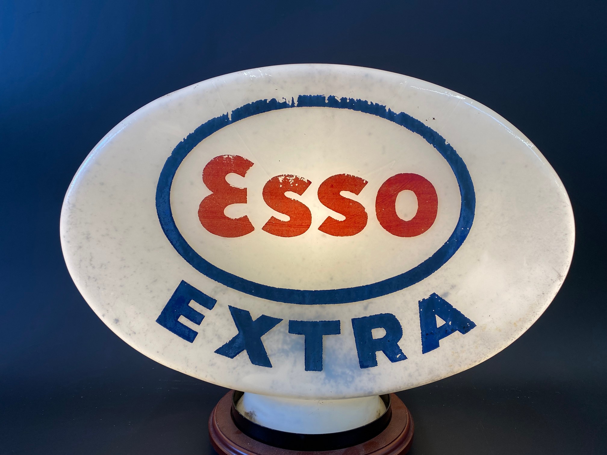 An Esso Extra glass petrol pump globe, fully stamped underneath 'Property of Esso Petroleum Co