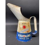 A Havoline Motor Oil quart measure.
