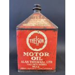 A Thelson Motor Oil pyramid gallon can.