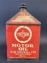 A Thelson Motor Oil pyramid gallon can.