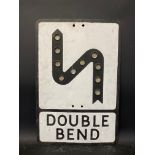 A metal road sign for Double Bend with integral glass reflectors, 14 x 21".