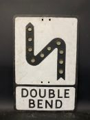 A metal road sign for Double Bend with integral glass reflectors, 14 x 21