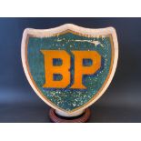 A BP shield shaped glass petrol pump globe by Hailware, fully stamped underneath.