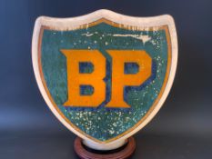 A BP shield shaped glass petrol pump globe by Hailware, fully stamped underneath.