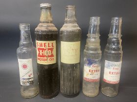 Two Esso Extra Motor Oil pint bottles, a Havoline pint bottle and two Shell X-100 quart bottles.