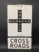 A metal road sign for Cross Roads, with integral glass reflective discs, 12 x 21".