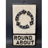 A cast iron road sign for Round About with integral glass reflectors, 11 3/4 x 20 3/4".