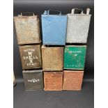 Nine assorted two gallon petrol cans including Shell Mex Motor Spirit.