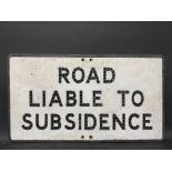 An aluminium road sign for Road Liable To Subsidence, with holes for reflective beads, 30 x 16 3/