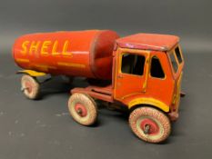 A clockwork tinplate model of an articulated petrol tanker in Shell BP livery.