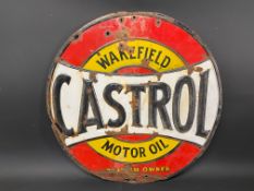 A Continental Wakefield Castrol embossed steel enamel sign, 24" diameter.