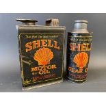 A Shell Motor Oil half gallon can, plus a Shell Gear Oil cylindrical quart can, with original cap.